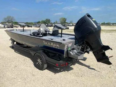 Slide: The Image of 2025 SeaArk Flex 19 Pro boat on trailer, featuring powerful outboard motor. - 4
