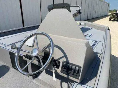 Slide: The Image of 2025 SeaArk Flex 19 Pro boat console with steering wheel and control panel. - 7