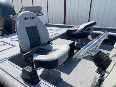 Slide: The Image of 2025 SeaArk Flex 19 Pro boat interior with steering wheel and seating. - 8