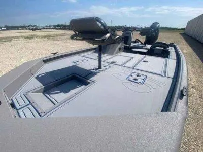 Slide: The Image of 2025 SeaArk Flex 19 Pro boat deck with seating and storage compartments. - 9