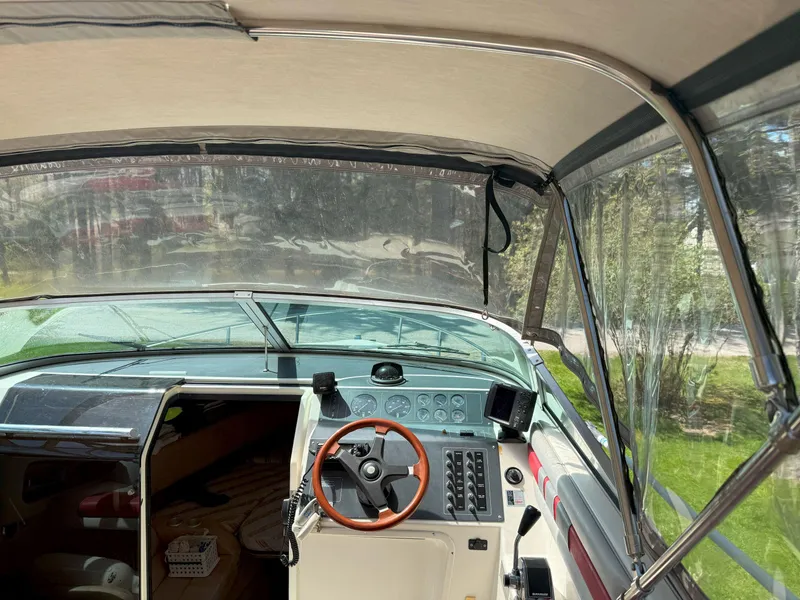 Slide: The Image of 1988 Slickcraft 268 SC boat interior with steering wheel and control panel. - 19