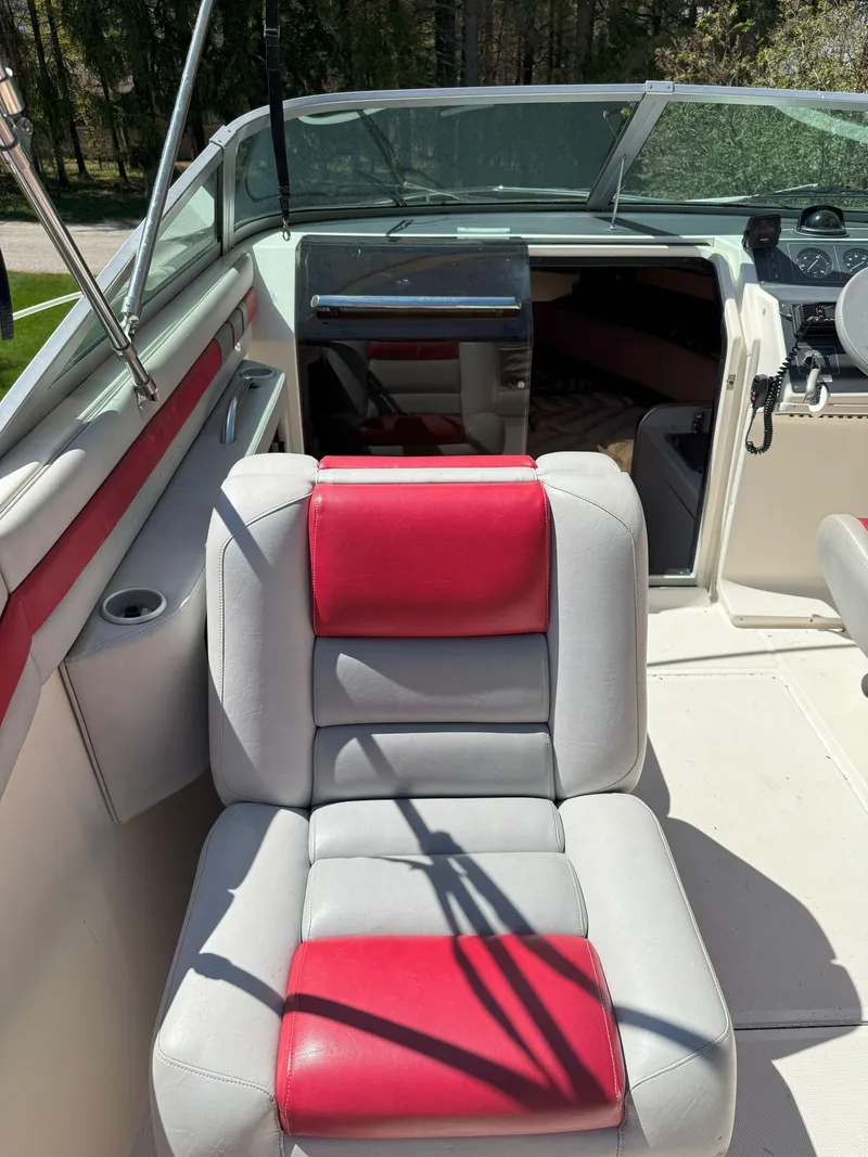 Slide: The Image of 1988 Slickcraft 268 SC boat interior with red and gray seating. - 21