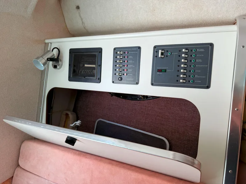 Slide: The Image of Control panel inside 1988 Slickcraft 268 SC boat cabin with switches and light. - 37