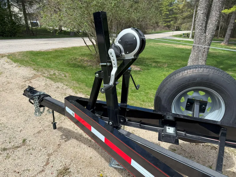 Slide: The Image of Trailer hitch and winch for 1988 Slickcraft 268 SC boat, parked on gravel. - 45