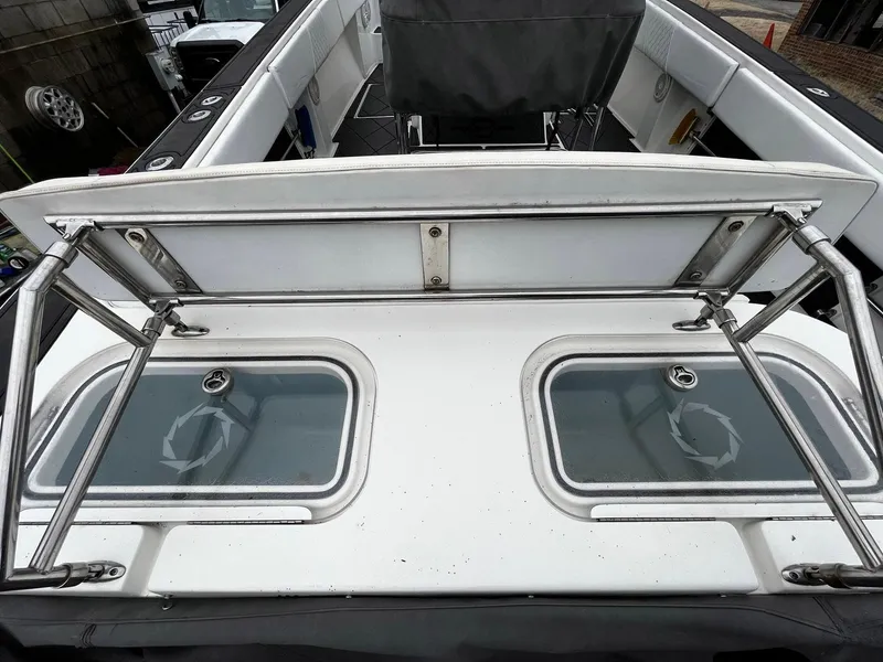 Slide: The Image of 2011 Fountain 38 CC Tournament Edition boat deck with storage compartments. - 28