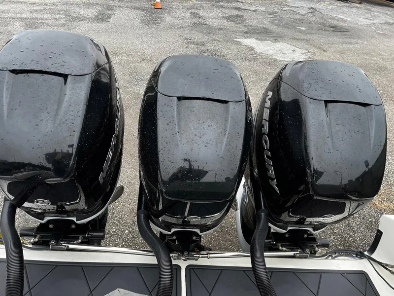 Slide: The Image of Three Mercury outboard engines on a 2011 Fountain 38 CC Tournament Edition boat. - 29