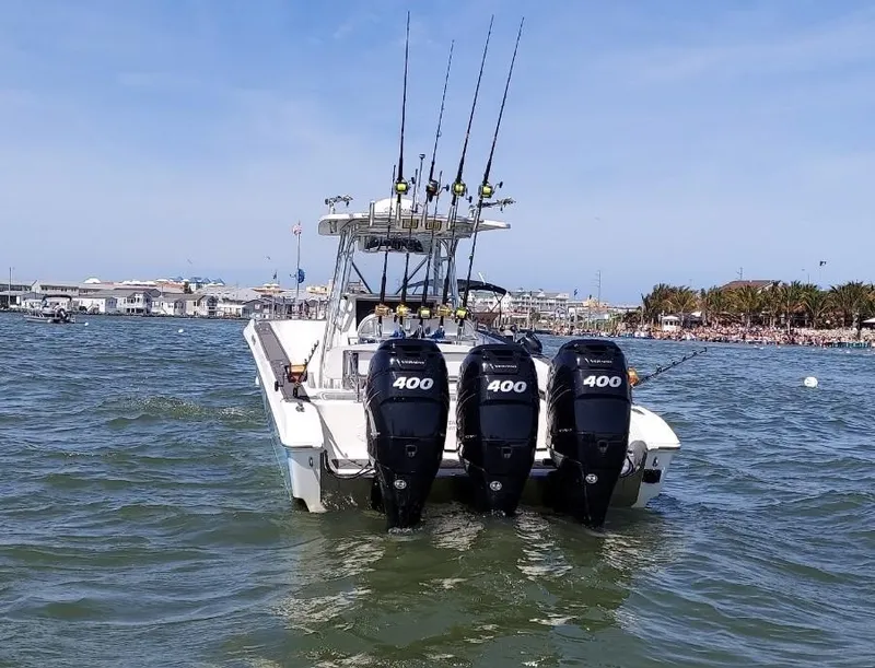 Slide: The Image of 2011 Fountain 38 CC Tournament Edition boat with triple 400 horsepower engines on water. - 3