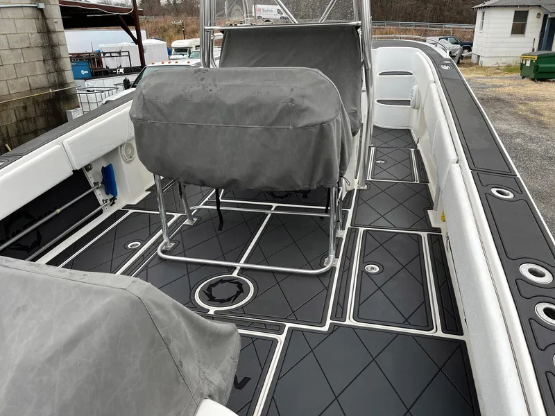 Slide: The Image of 2011 Fountain 38 CC Tournament Edition boat with covered seating and sleek deck design. - 33