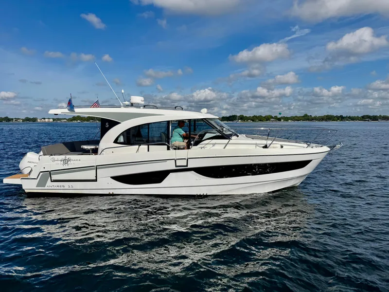 Slide: The Image of 2024 Beneteau Antares 11 cruising on a sunny day with clear skies. - 1