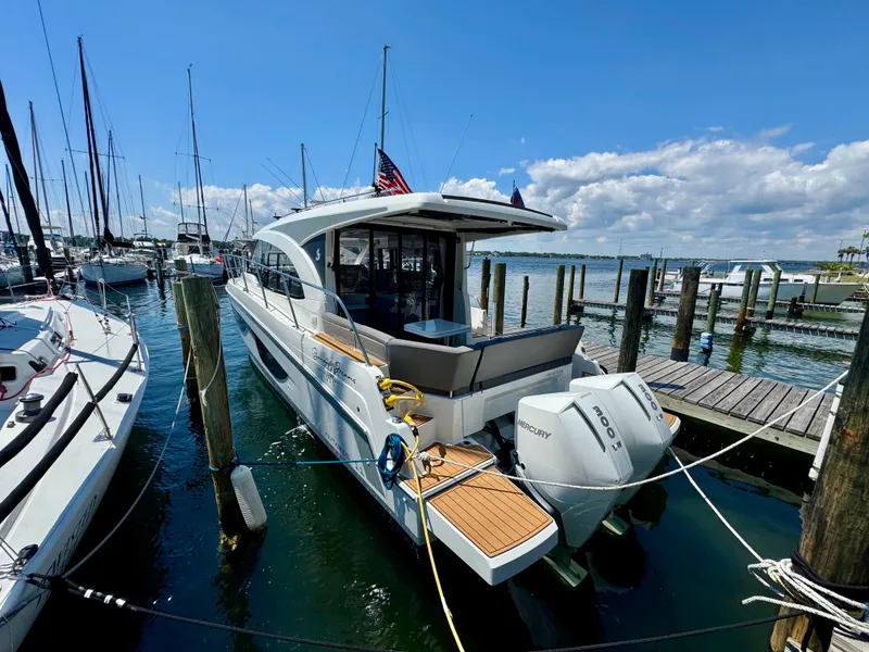 Slide: The Image of 2024 Beneteau Antares 11 docked at marina, sunny day, calm waters. - 10