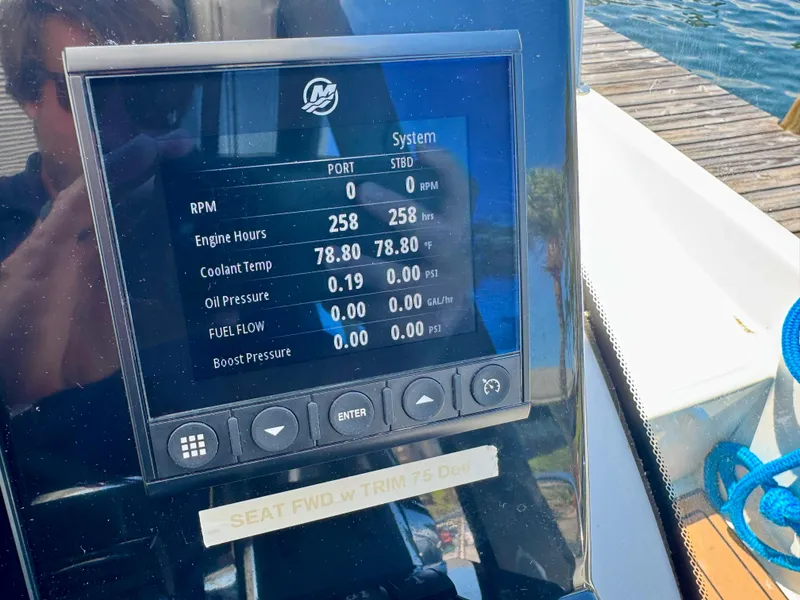 Slide: The Image of Display screen on 2024 Beneteau Antares 11 showing engine metrics and system status. - 18