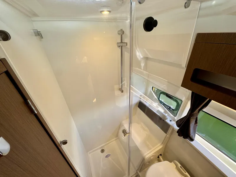 Slide: The Image of 2024 Beneteau Antares 11 bathroom with modern shower and sleek design. - 26