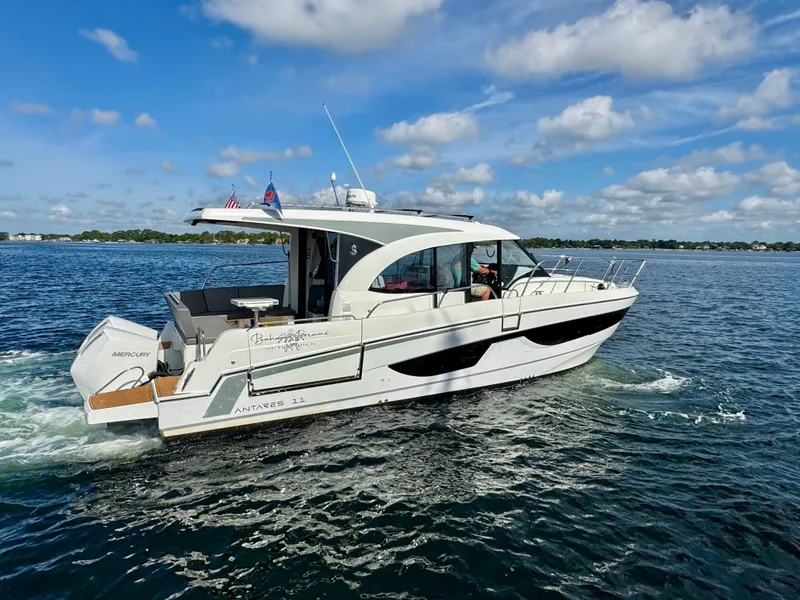 Slide: The Image of 2024 Beneteau Antares 11 cruising on a sunny day with clear skies. - 6