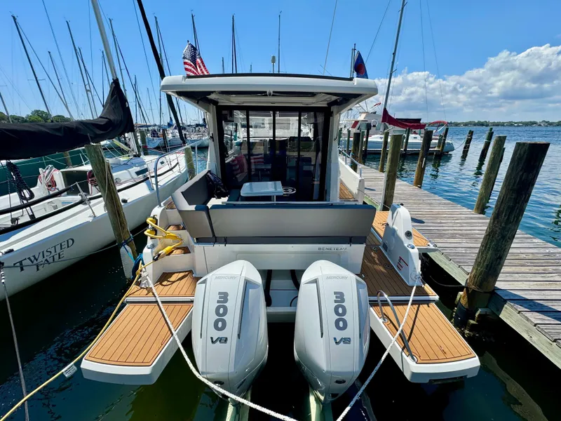 Slide: The Image of 2024 Beneteau Antares 11 docked, featuring twin 300 V8 engines, in a marina setting. - 9