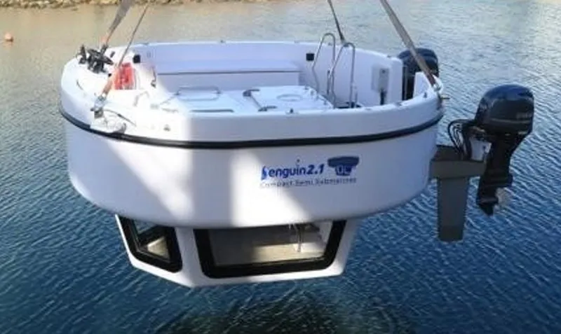 Slide: The Image of 2025 Penguin Semi-Submarine 2.1 Gasoline floating on water, showcasing its unique design and features. - 6