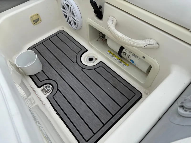 Slide: The Image of Interior of a 2007 Zodiac Yachtline 380DL boat showing a non-slip mat and cup holder. - 10
