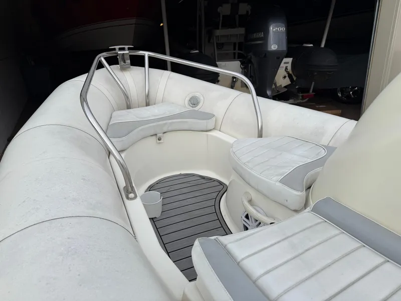 Slide: The Image of 2007 Zodiac Yachtline 380DL inflatable boat interior with cushioned seating and stainless steel railings. - 12