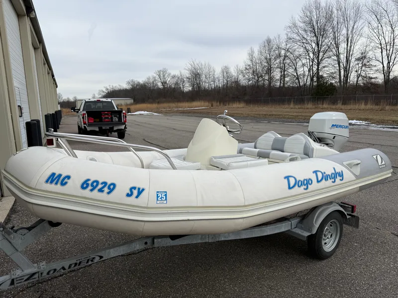 Slide: The Image of 2007 Zodiac Yachtline 380DL inflatable boat on trailer, labeled "Dago Dinghy." - 3