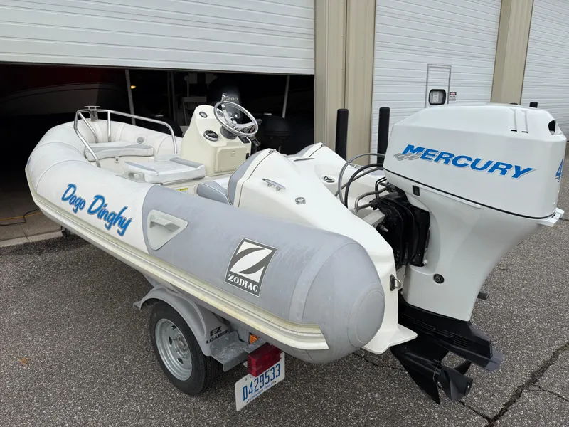 Slide: The Image of 2007 Zodiac Yachtline 380DL inflatable boat with Mercury outboard motor on a trailer. - 4