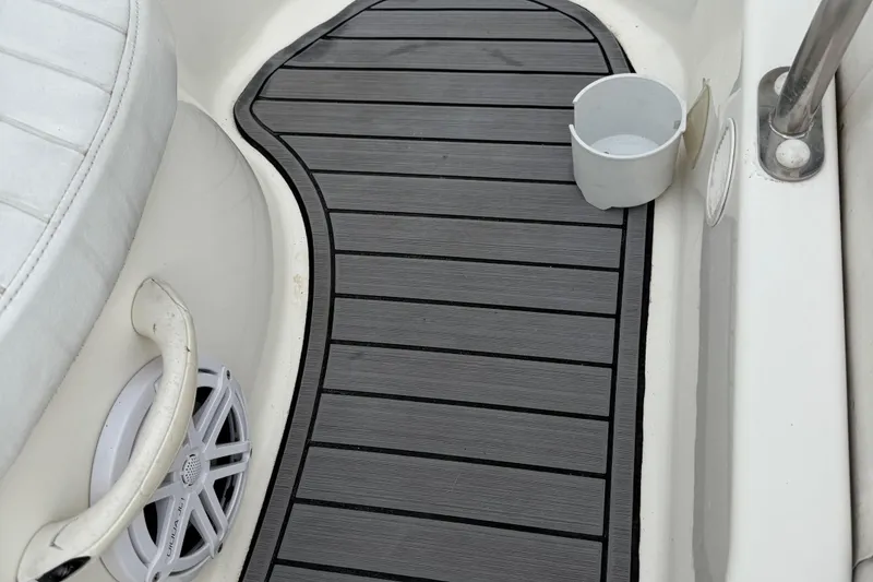 Slide: The Image of 2007 Zodiac Yachtline 380DL boat interior with non-slip flooring and cup holder. - 9