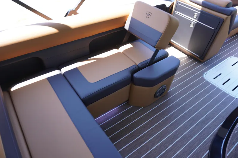 Slide: The Image of 2025 Premier 250 Sunsation RS interior with brown and black seating, wood-style flooring. - 12