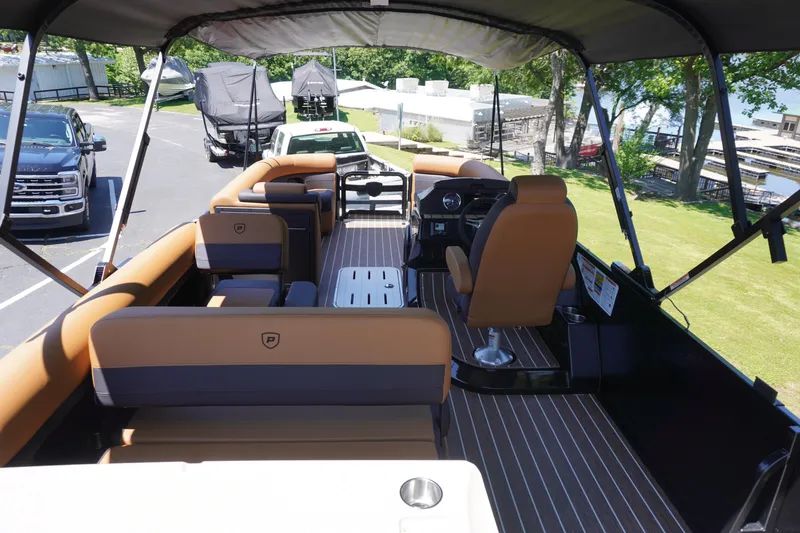 Slide: The Image of 2025 Premier 250 Sunsation RS pontoon boat with spacious seating and modern interior design. - 18