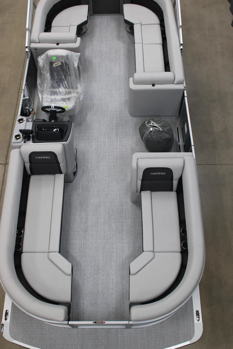 Slide: The Image of 2025 Harris Cruiser 230 CW pontoon boat interior with gray seating and spacious layout. - 3