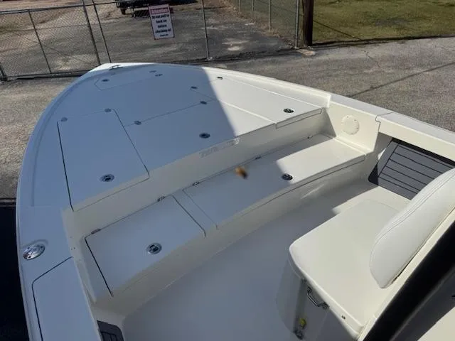 Slide: The Image of 2025 Pathfinder 2500 Hybrid boat deck with seating and storage compartments. - 11