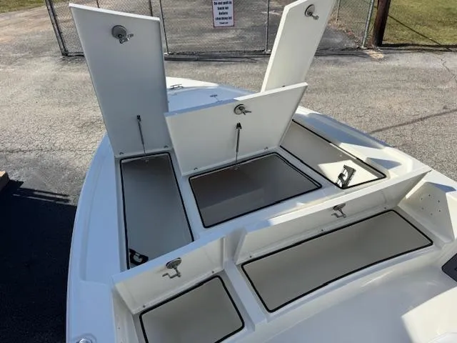 Slide: The Image of 2025 Pathfinder 2500 Hybrid boat with open storage compartments on deck. - 12
