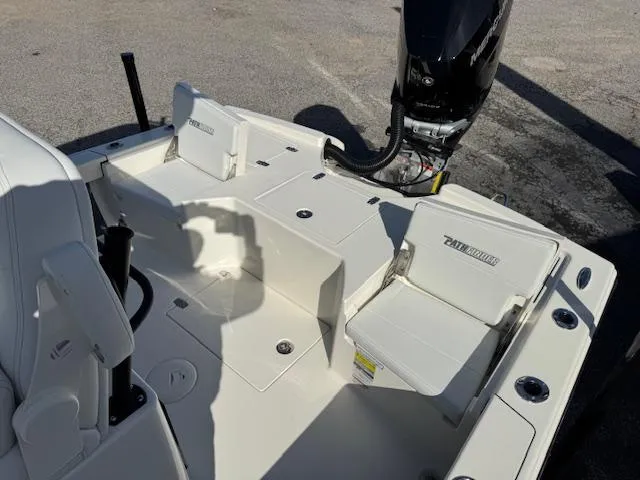 Slide: The Image of 2025 Pathfinder 2500 Hybrid boat interior with seating and motor, showcasing modern design. - 13