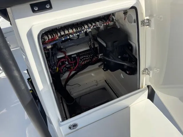 Slide: The Image of Open electrical compartment of 2025 Pathfinder 2500 Hybrid boat, showcasing wiring and components. - 18