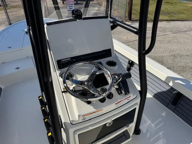 Slide: The Image of 2025 Pathfinder 2500 Hybrid boat console with steering wheel and controls. - 21