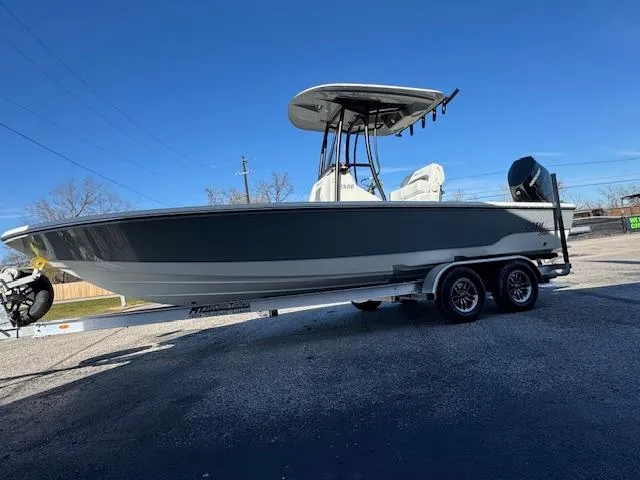 Slide: The Image of 2025 Pathfinder 2500 Hybrid boat on trailer under clear blue sky. - 5