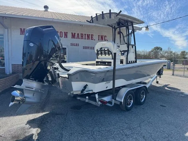 Slide: The Image of 2025 Pathfinder 2500 Hybrid boat on trailer at dealership, rear view. - 6