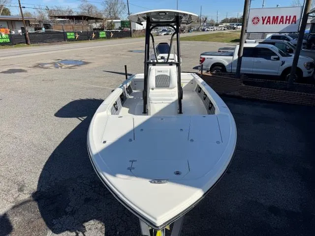 Slide: The Image of 2025 Pathfinder 2500 Hybrid boat displayed outdoors near Yamaha sign. - 7