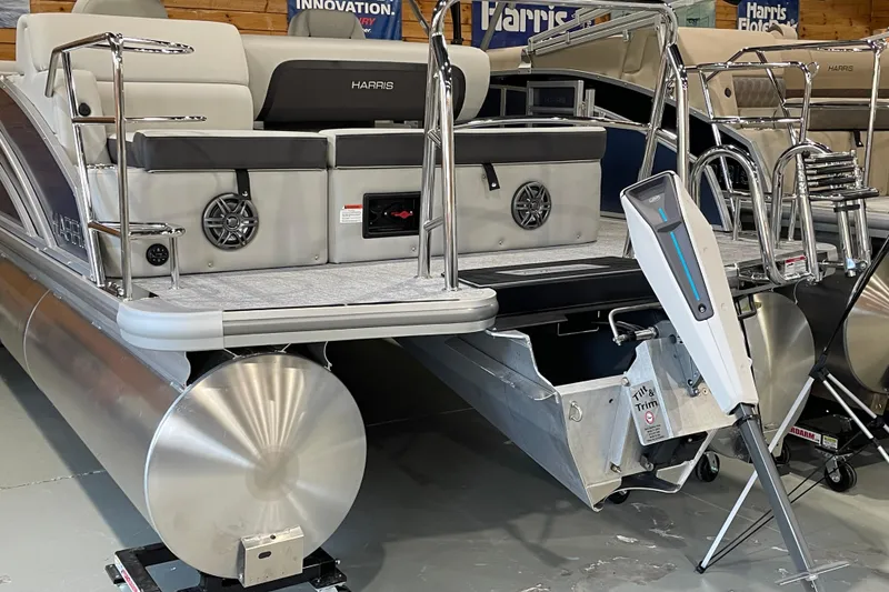 Slide: The Image of 2025 Harris Cruiser 210 pontoon boat with modern seating and sleek design. - 2