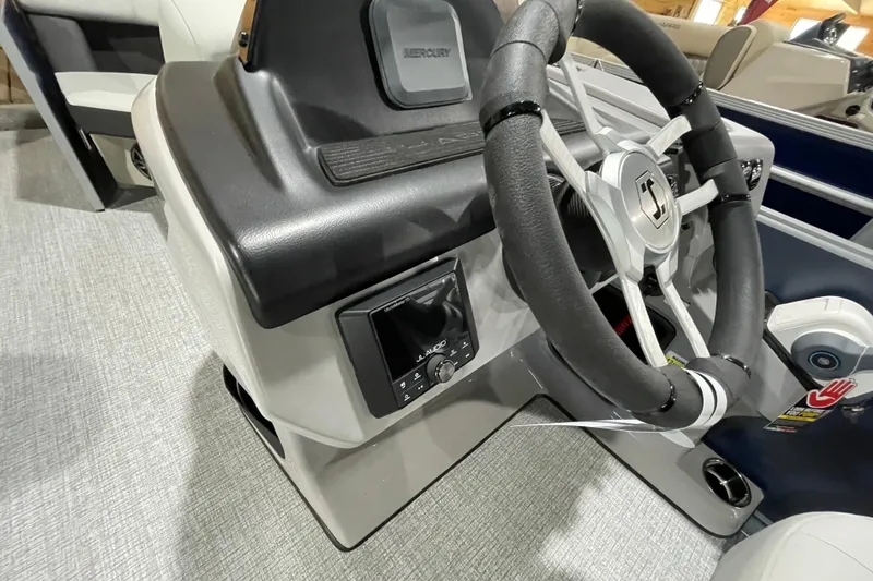 Slide: The Image of 2025 Harris Cruiser 210 steering console with modern controls and sleek design. - 6