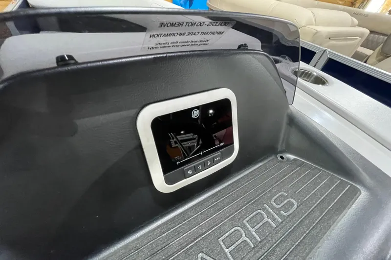 Slide: The Image of 2025 Harris Cruiser 210 dashboard with digital display and control panel. - 7