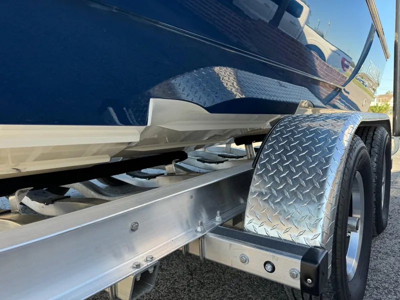 Slide: The Image of 2025 Pathfinder 2500 Hybrid boat on trailer with diamond plate fender. - 17