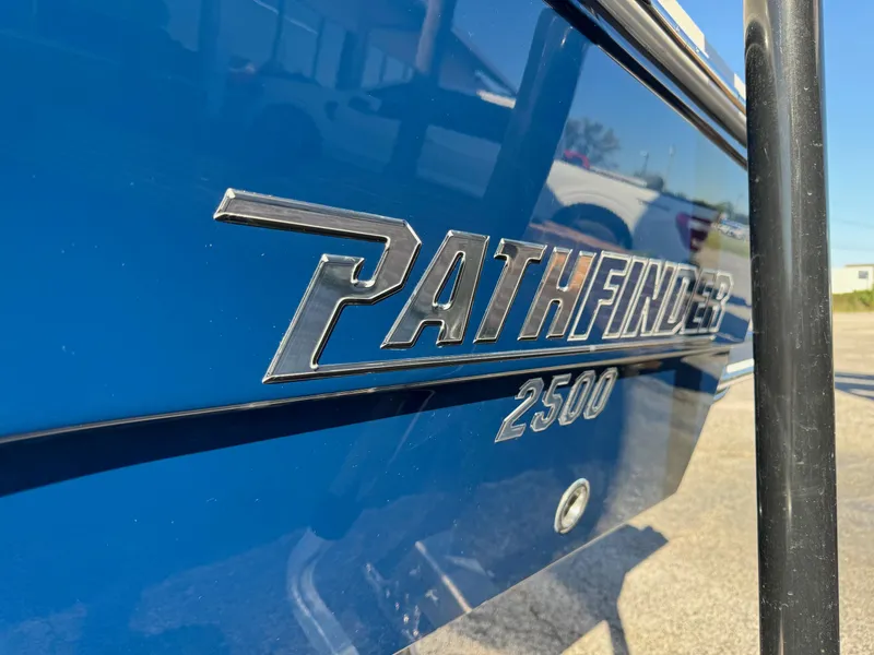 Slide: The Image of 2025 Pathfinder 2500 Hybrid boat, blue exterior with logo detail. - 18