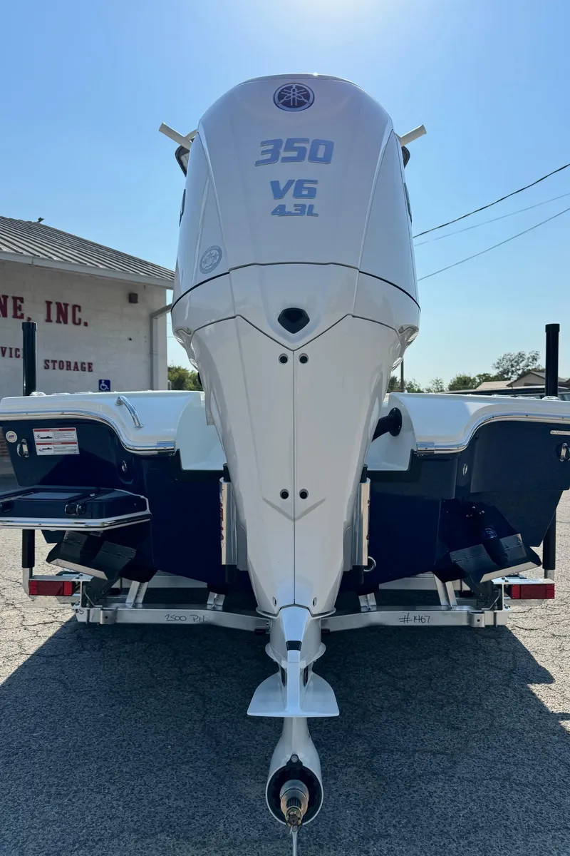 Slide: The Image of 2025 Pathfinder 2500 Hybrid boat with 350 V6 4.3L engine on trailer. - 22