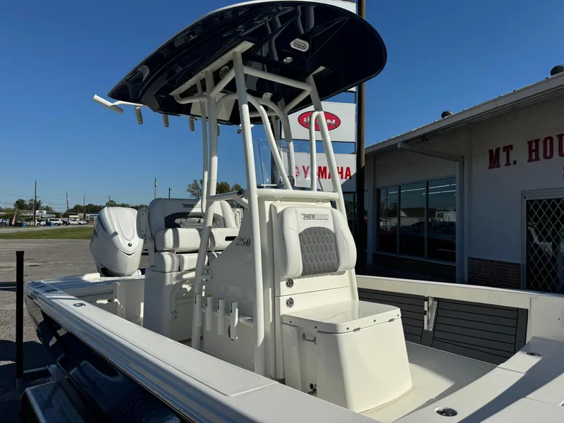 Slide: The Image of 2025 Pathfinder 2500 Hybrid boat with T-top, displayed outdoors near dealership. - 7