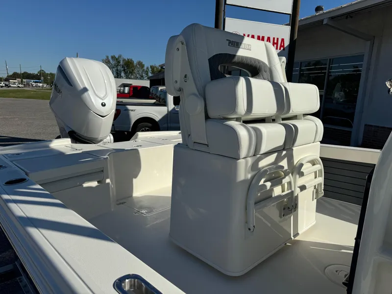 Slide: The Image of 2025 Pathfinder 2500 Hybrid boat interior with Yamaha engine, featuring cushioned seating. - 9