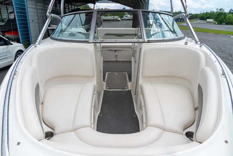 Slide: The Image of 2006 Chaparral 220 SSi boat interior with white seating and open bow design. - 15