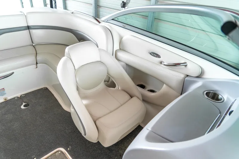 Slide: The Image of 2006 Chaparral 220 SSi boat interior with white seating and modern design. - 18
