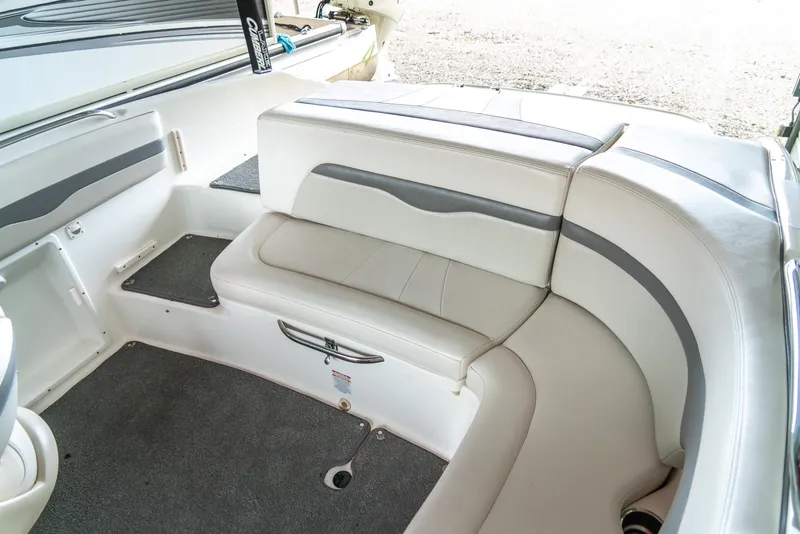 Slide: The Image of 2006 Chaparral 220 SSi boat interior with white and gray seating. - 20