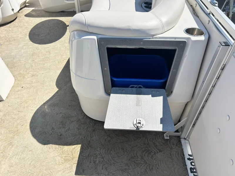 Slide: The Image of 2006 Harris 230 Royal Heritage boat seat with built-in storage compartment and cup holder. - 11