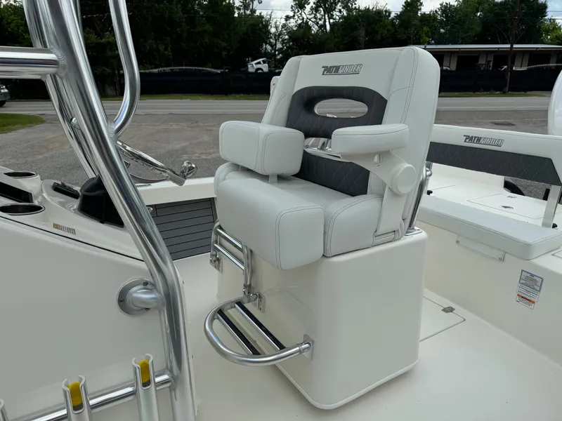 Slide: The Image of 2024 Pathfinder 2600 HPS boat seat with armrests and footrest, featuring sleek design. - 10