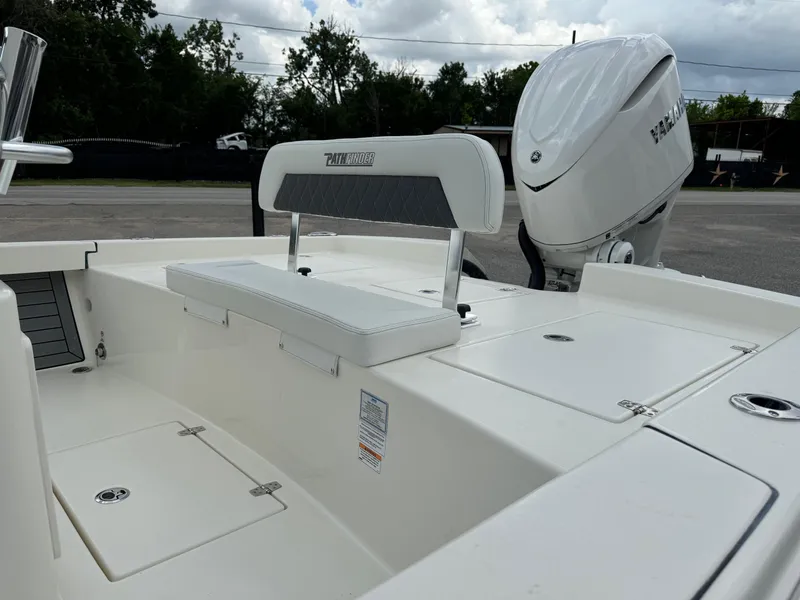 Slide: The Image of 2024 Pathfinder 2600 HPS boat with Yamaha outboard motor, featuring a sleek white deck design. - 11