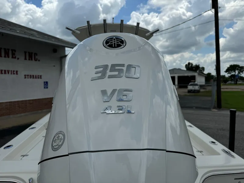 Slide: The Image of 2024 Pathfinder 2600 HPS boat with Yamaha 350 V6 4.3L engine, outdoor setting. - 12